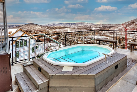 Look out across snowy peaks from the community hot tub