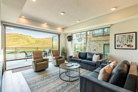 Spill out onto the balcony with mountain scenery beyond