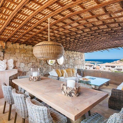 Dine under the balcony's extraordinary wicker ceiling