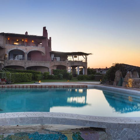 Take a sunset dip in the swimming pool