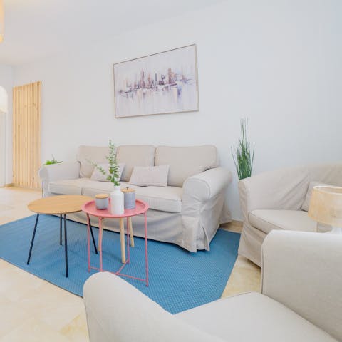 Get comfy on the plush sofa and enjoy an evening of movies and wine