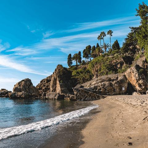 Spend the afternoon relaxing on Nerja beach
