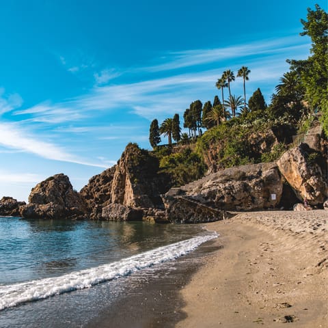 Spend the afternoon relaxing on Nerja beach