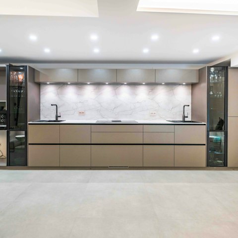 Prepare meals in the sleek and contemporary kitchen