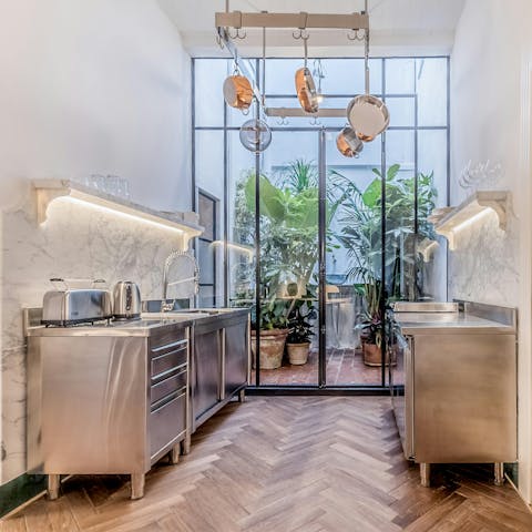 Open the doors to the sunroom and cook some Italian cuisine in the industrial-style kitchen