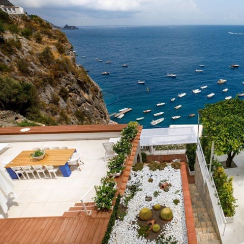 Dine alfresco on the terrace with sweeping views of the Med