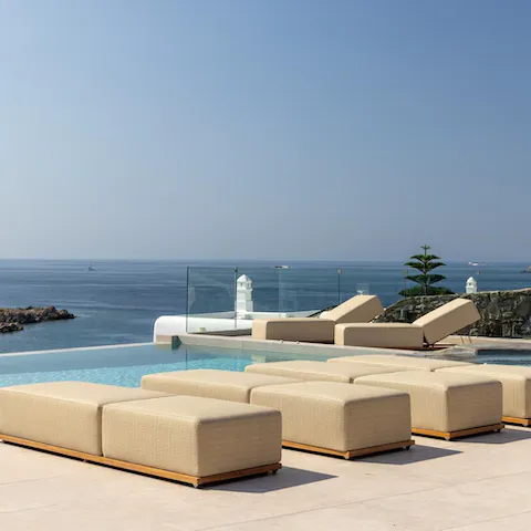 Relax on one of the sumptuous sun beds or take a dip in the infinity pool