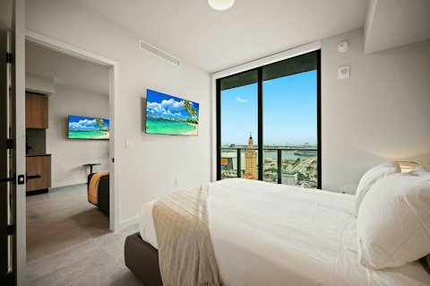 Rise each morning to sweeping vistas of the bay and city skyline