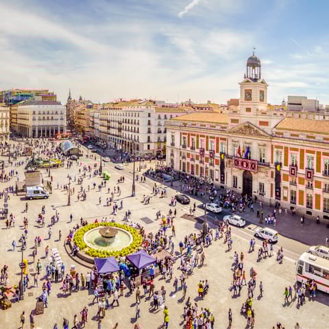 Visit bustling Puerta del Sol, an eight-minute stroll from your door