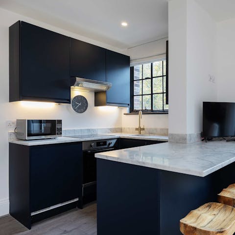 Rustle up a light bite in the sleek kitchen