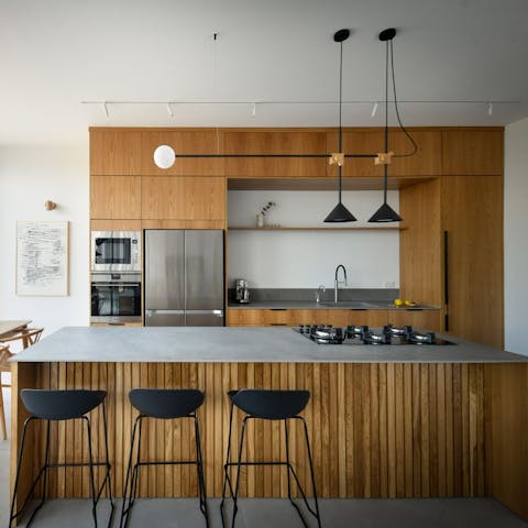 Enjoy cooking in the zen-style kitchen with its sleek breakfast bar