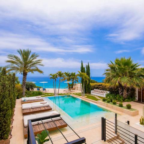 While away the hours luxuriating in the communal pool or lounging in the sun