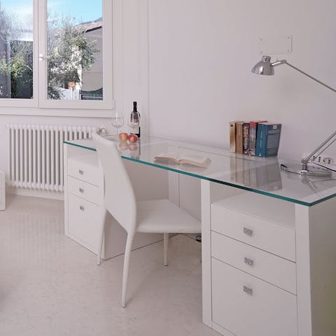 Catch up on work emails at the desk in the study