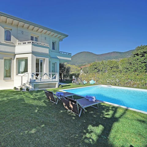 Lounge in the sun after a dip in the swimming pool