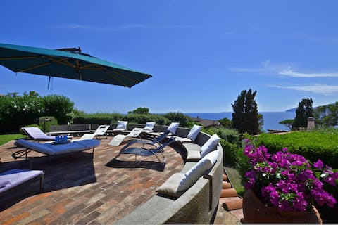 Hang out on the sprawling terrace with a glass of wine in hand