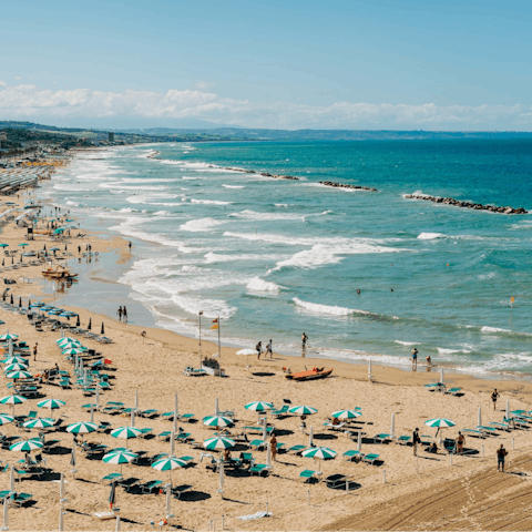 Stroll along the sandy beach, a 1.6 kilometre walk from your home