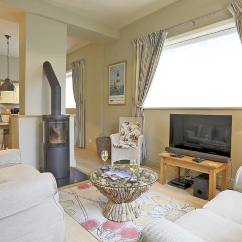 Have a cosy movie night next to the modern fireplace