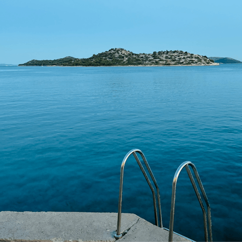 Explore Tribunj's coastline, less than a ten-minute stroll away