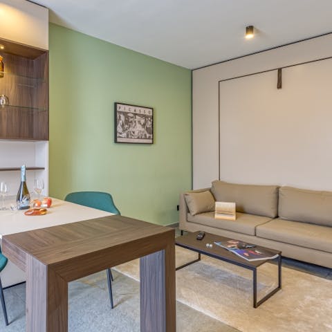 Snuggle up on the comfy sofa or enjoy a meal for two at the dining table