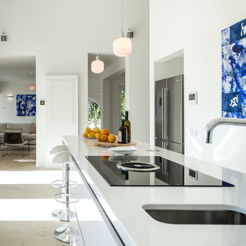 Flex your culinary muscles in the sleek kitchen