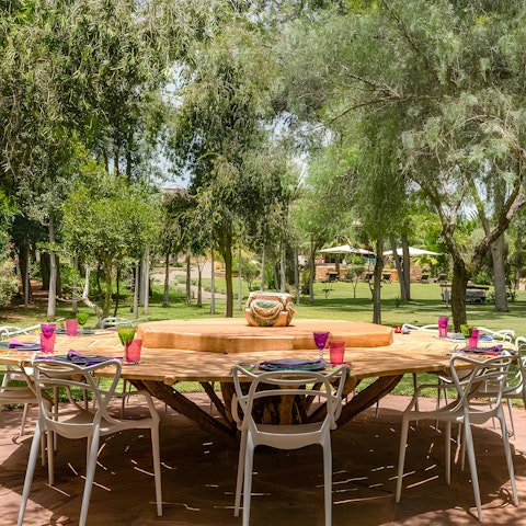 Dine beneath the trees in the garden