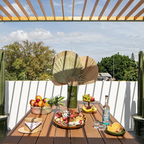 Relax with mezcal cocktails in the rooftop lounge