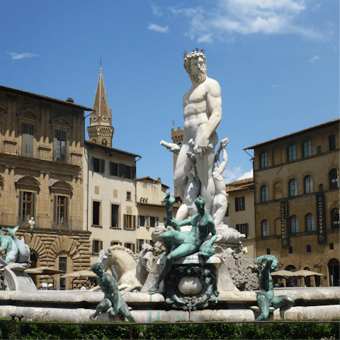 See the Fountain of Neptune, just outside the door