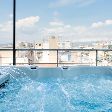 Look over Athens from the comfort of the shared jacuzzi
