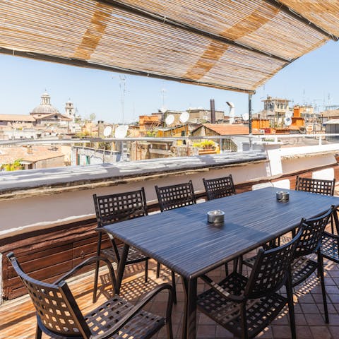 Relax on the shaded terrace overlooking the Roman rooftops