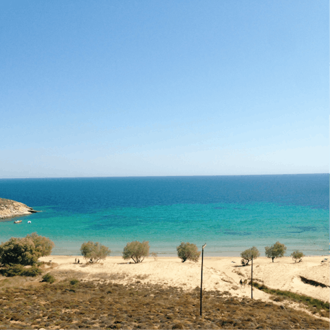 Head for Ornos Beach to enjoy a day on the golden sand – it's just two kilometres away