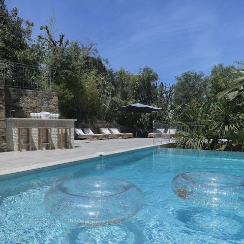 Spend your morning floating in the private pool under clear blue skies