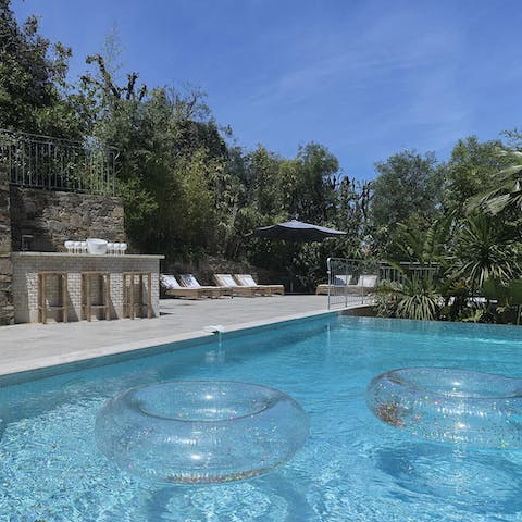 Spend your morning floating in the private pool under clear blue skies