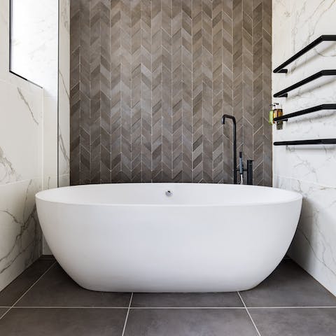 Treat yourself to half an hour's peace in the chic freestanding bathtub