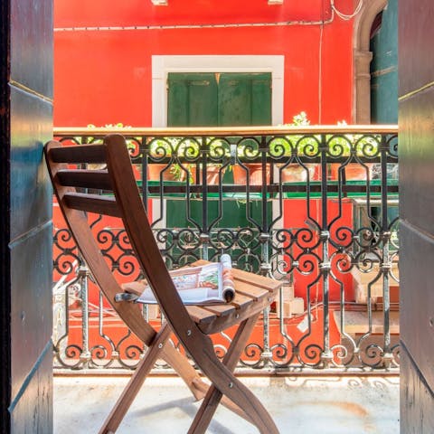 Enjoy watching the world go by from the small balcony