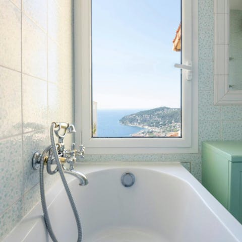 Enjoy a relaxing soak with sea views from the bath