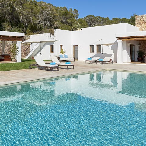 Relax on a lounger by the pool