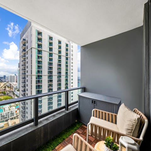 Sit on the balcony with a glass of wine