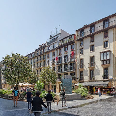 Step out the door and straight onto Plaza de la Bretxa, home to a daily market selling local produce