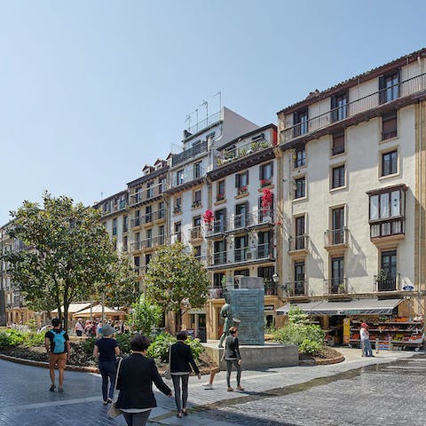 Step out the door and straight onto Plaza de la Bretxa, home to a daily market selling local produce