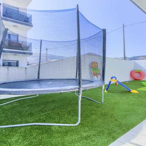 Let the kids have fun bouncing on the trampoline and playing in the garden