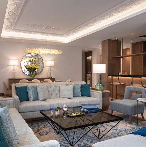 Cosy up in your plush private living area with a flute of champagne