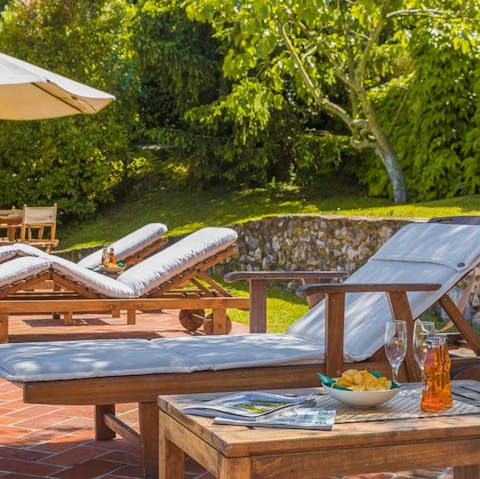 Work on the perfect tan on the sun loungers