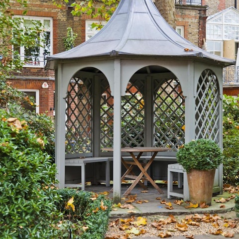 Find a quiet corner in the mature communal gardens