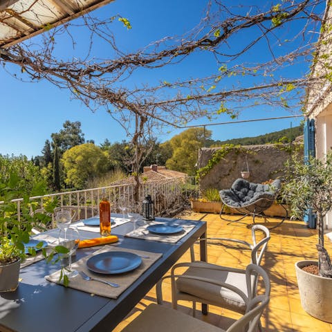 Relax in the Provençal sun on the balcony with its town and countryside views