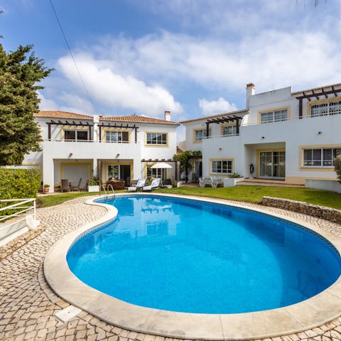 Chill out back at home in the communal pool – it's just a few steps from the patio