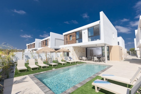Stretch out on a sun lounger beside the sparkling pool