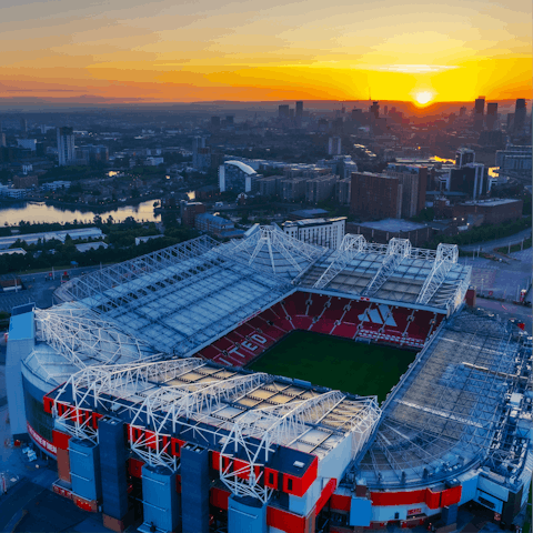 Marvel at Old Trafford, one of the world's most iconic football stadiums - just down the road