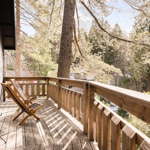 Soak up the fresh mountain air while relaxing on the deck