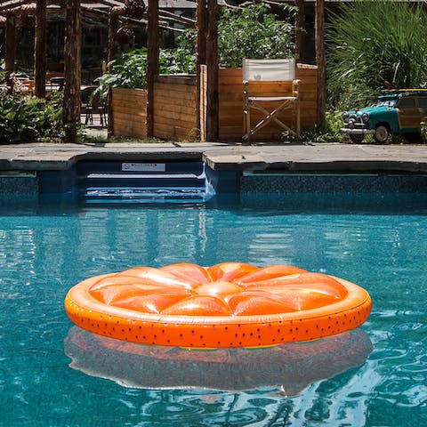 Float around the pool and gaze up at the trees