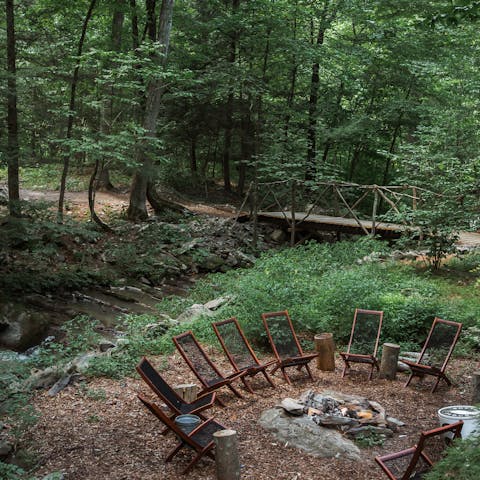 Toast marshmallows around the campfire and listen to the rippling creek behind